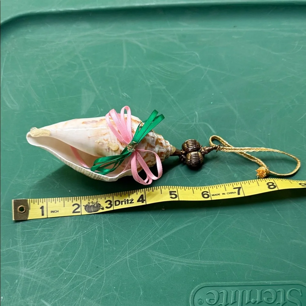 Elegant Shell Ornament with Pink and Green Accents